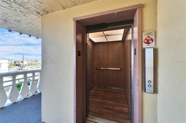 property entrance featuring a balcony and elevator