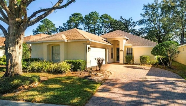 mediterranean / spanish-style home with a garage