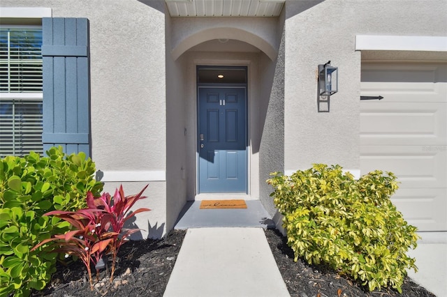 property entrance featuring a garage