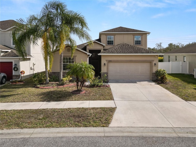 view of front of property with a garage and a front yard