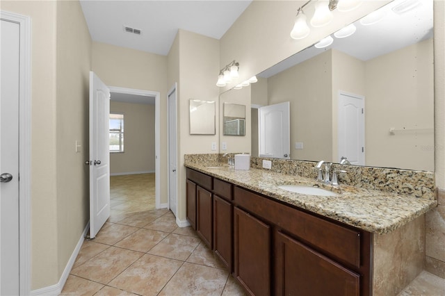 bathroom with vanity and tile patterned flooring