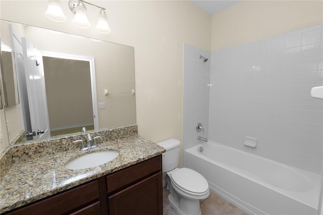 full bathroom featuring vanity, tiled shower / bath combo, and toilet