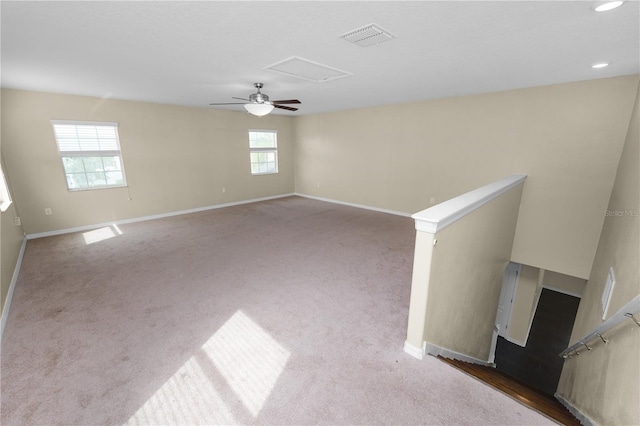 spare room with carpet and a wealth of natural light