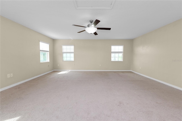 empty room with light carpet and plenty of natural light