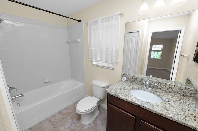 full bathroom with tiled shower / bath, vanity, toilet, and tile patterned flooring