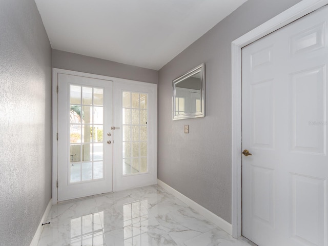 entryway featuring french doors