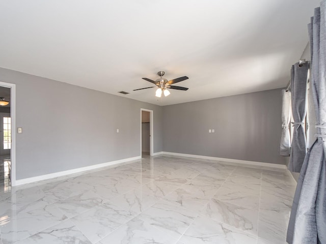 spare room featuring ceiling fan