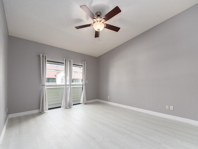 spare room featuring a textured ceiling, light hardwood / wood-style flooring, and ceiling fan