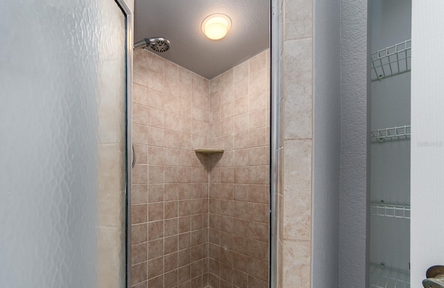 bathroom featuring tiled shower