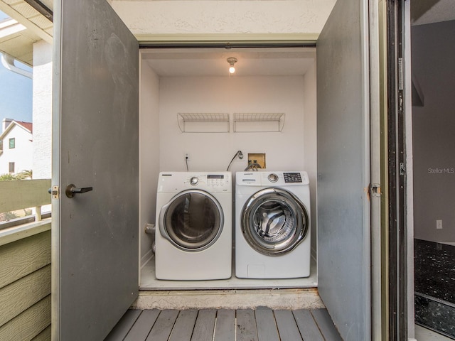 washroom featuring independent washer and dryer and light wood-type flooring