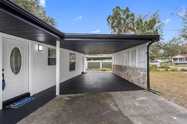 exterior space with a carport