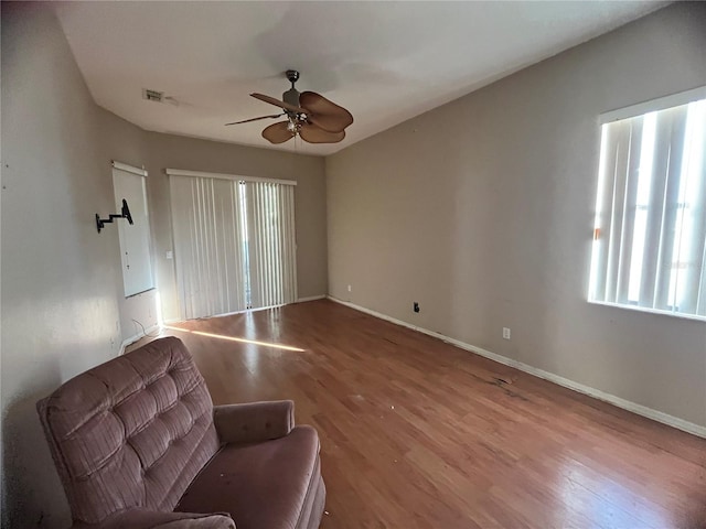 spare room featuring ceiling fan and hardwood / wood-style floors