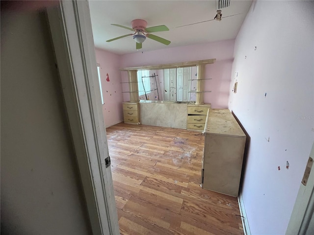 kitchen with ceiling fan and light hardwood / wood-style flooring