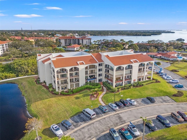 birds eye view of property featuring a water view