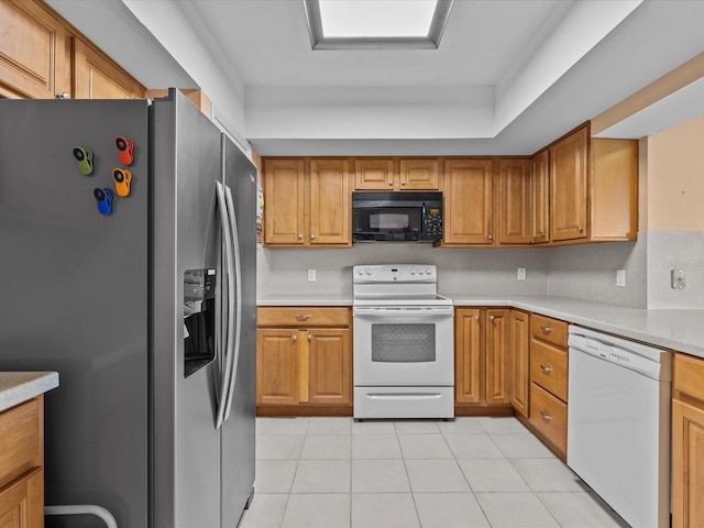 134 Mariner Dr Unit 134, Tarpon Springs, FL 34689 - kitchen with light tile patterned floors and white appliances