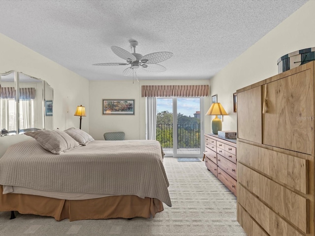 134 Mariner Dr Unit 134, Tarpon Springs, FL 34689 - carpeted bedroom with a textured ceiling, access to outside, and ceiling fan