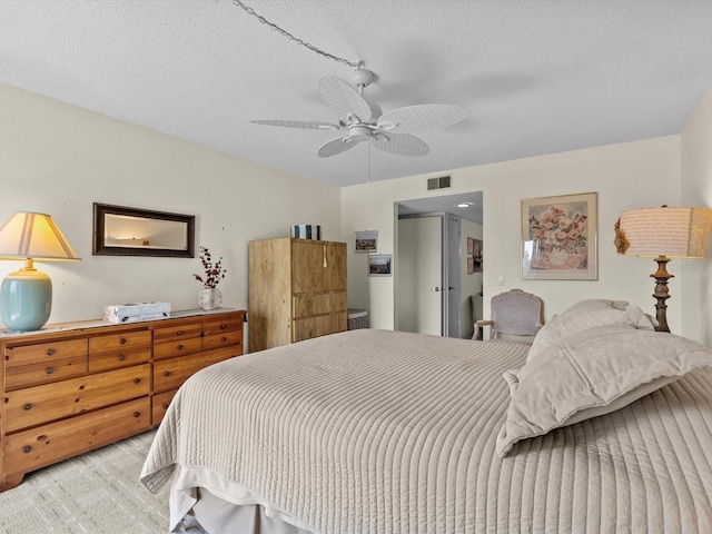 134 Mariner Dr Unit 134, Tarpon Springs, FL 34689 - bedroom with ceiling fan, light colored carpet, and a textured ceiling