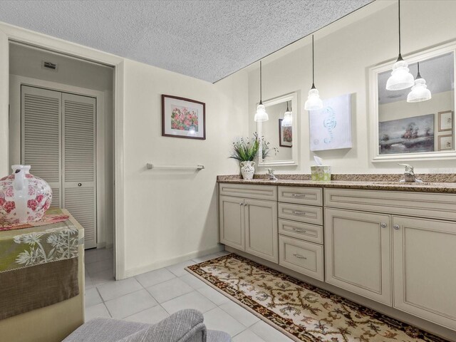 134 Mariner Dr Unit 134, Tarpon Springs, FL 34689 - bathroom featuring vanity, tile patterned flooring, and a textured ceiling