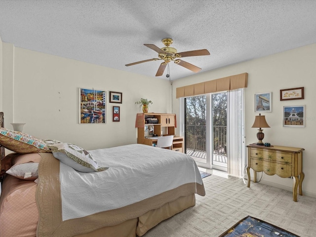 134 Mariner Dr Unit 134, Tarpon Springs, FL 34689 - carpeted bedroom featuring access to exterior, a textured ceiling, and ceiling fan