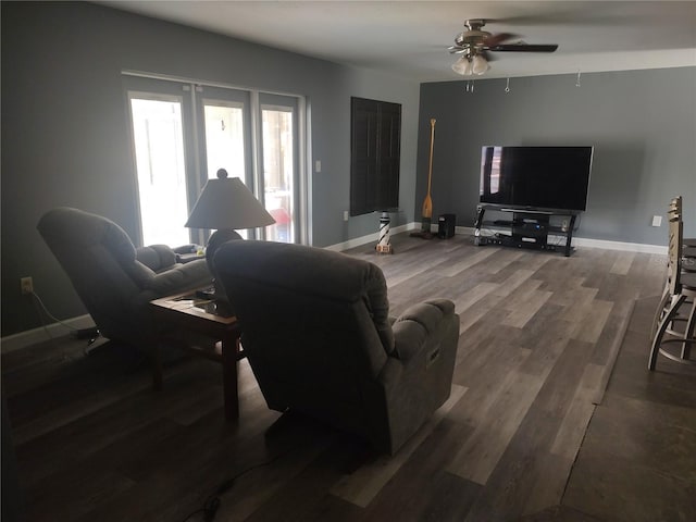 living room with ceiling fan and dark hardwood / wood-style floors