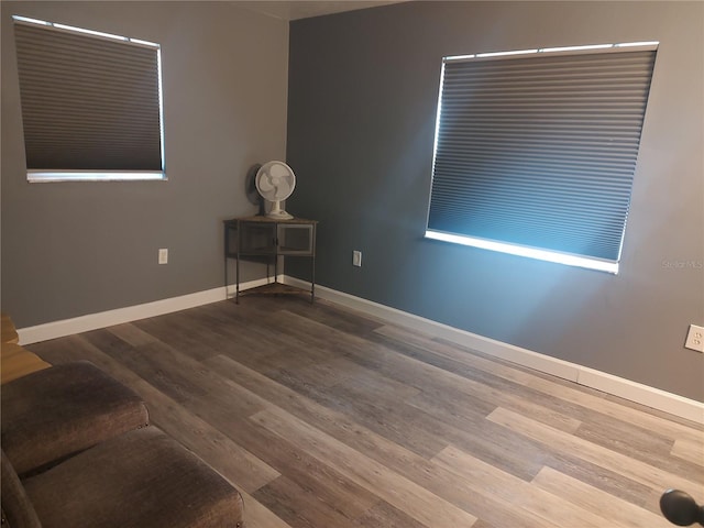 unfurnished room with hardwood / wood-style flooring