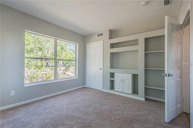 unfurnished bedroom featuring carpet