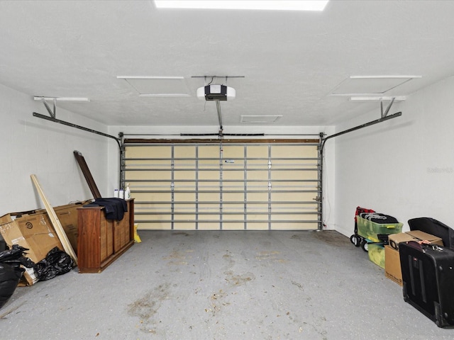 garage featuring a garage door opener