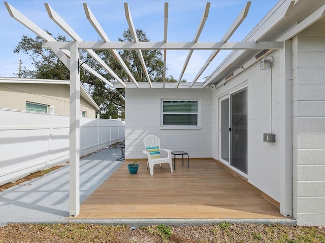 wooden terrace with a pergola