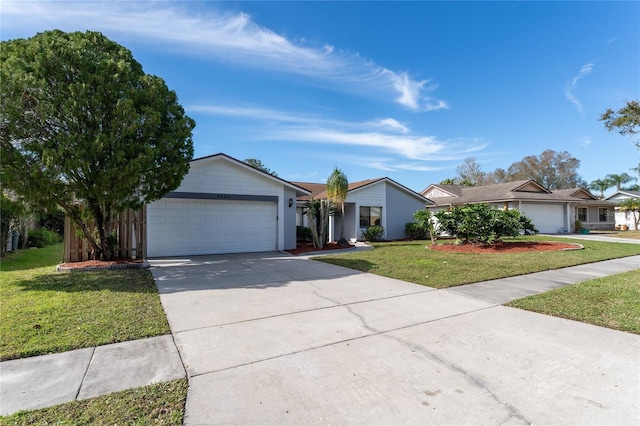 ranch-style house featuring a garage and a front yard