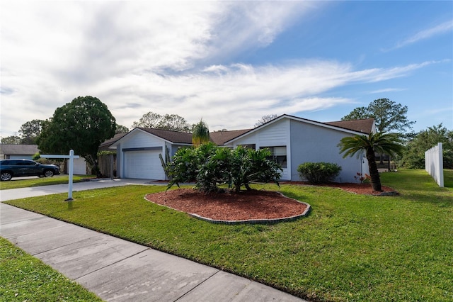 single story home with a garage and a front lawn