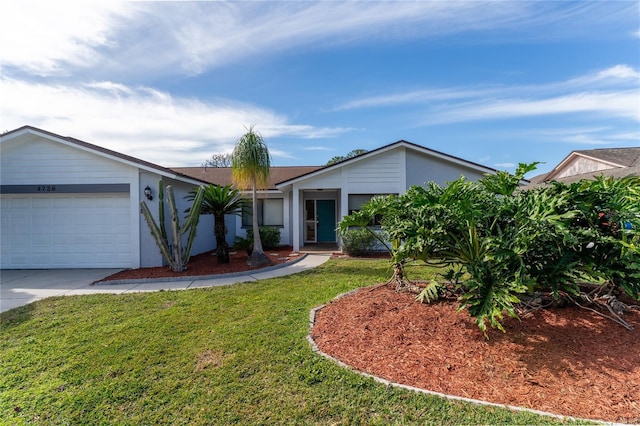 single story home featuring a garage and a front lawn