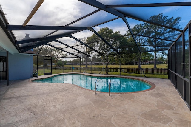 view of pool with a lanai and a patio