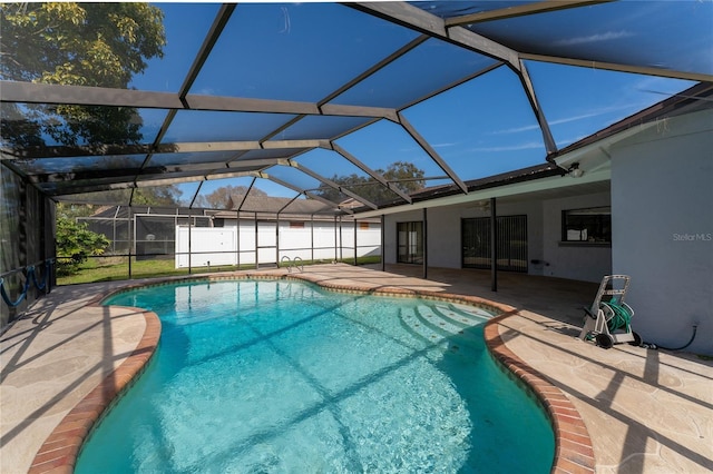 view of pool featuring a lanai and a patio area