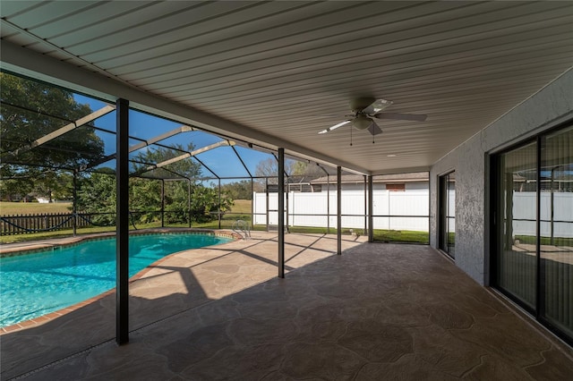 view of pool featuring a lanai, ceiling fan, and a patio area