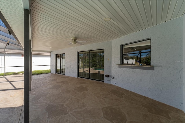 view of patio featuring ceiling fan