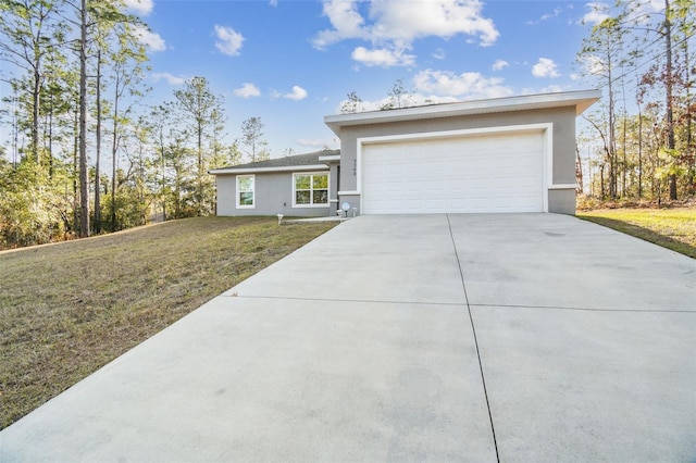 view of front of home featuring a garage and a front yard