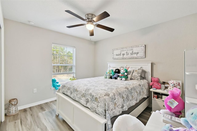 bedroom featuring ceiling fan and light wood-type flooring