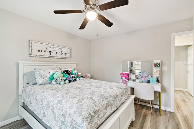 bedroom featuring ceiling fan and light wood-type flooring