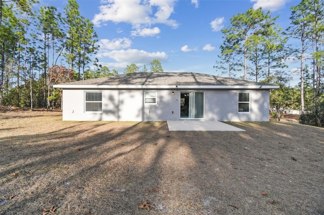 back of house with a patio area