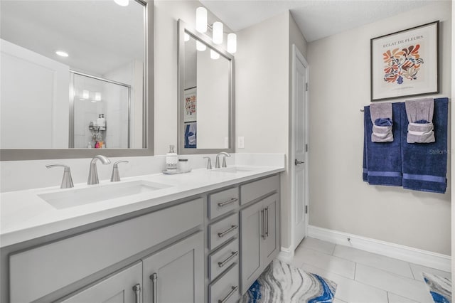 bathroom featuring vanity, tile patterned floors, and walk in shower