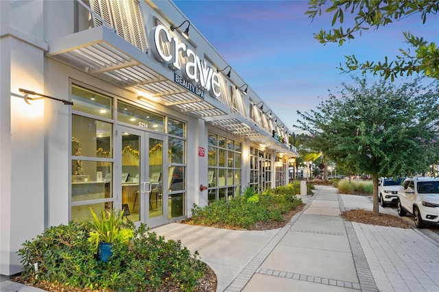 view of outdoor building at dusk