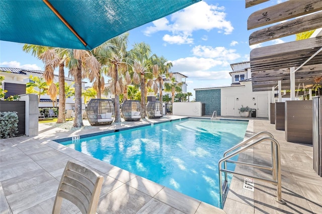 view of swimming pool with a patio