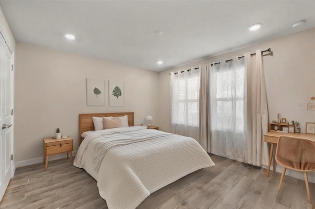 bedroom with light wood-type flooring