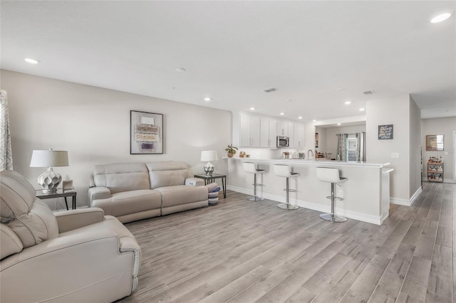 living room with light wood-type flooring