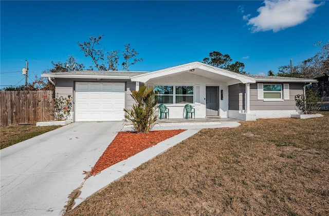 5405 Golden Nugget Dr, Holiday, FL 34690 - ranch-style house featuring a garage, a porch, and a front yard