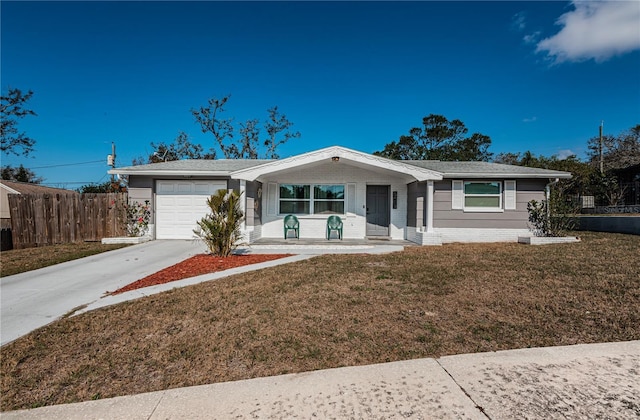 ranch-style home with a garage, a front lawn, and a porch