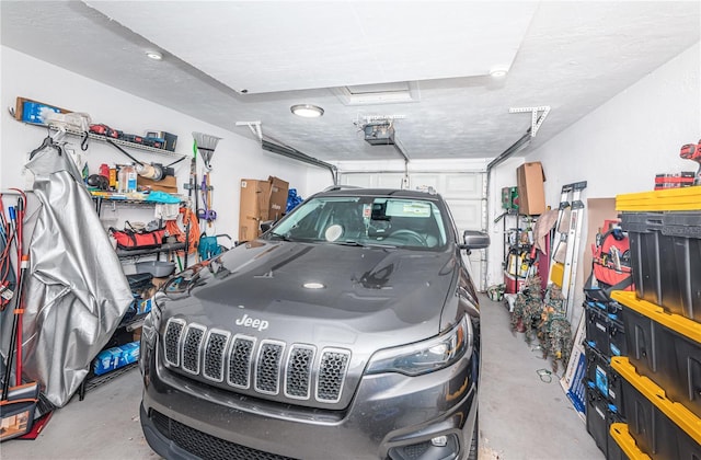 garage featuring a garage door opener