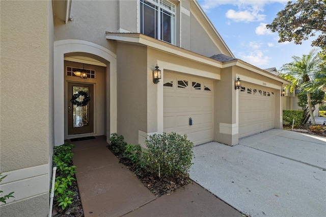 view of exterior entry with a garage