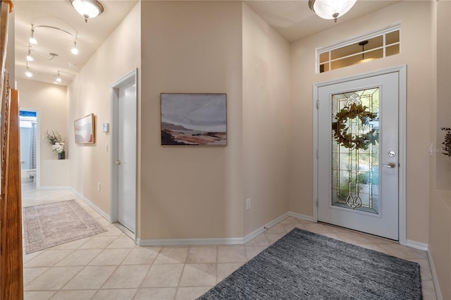 foyer with light tile patterned floors