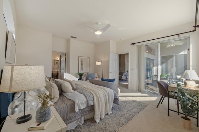 bedroom featuring light carpet, access to exterior, and ceiling fan